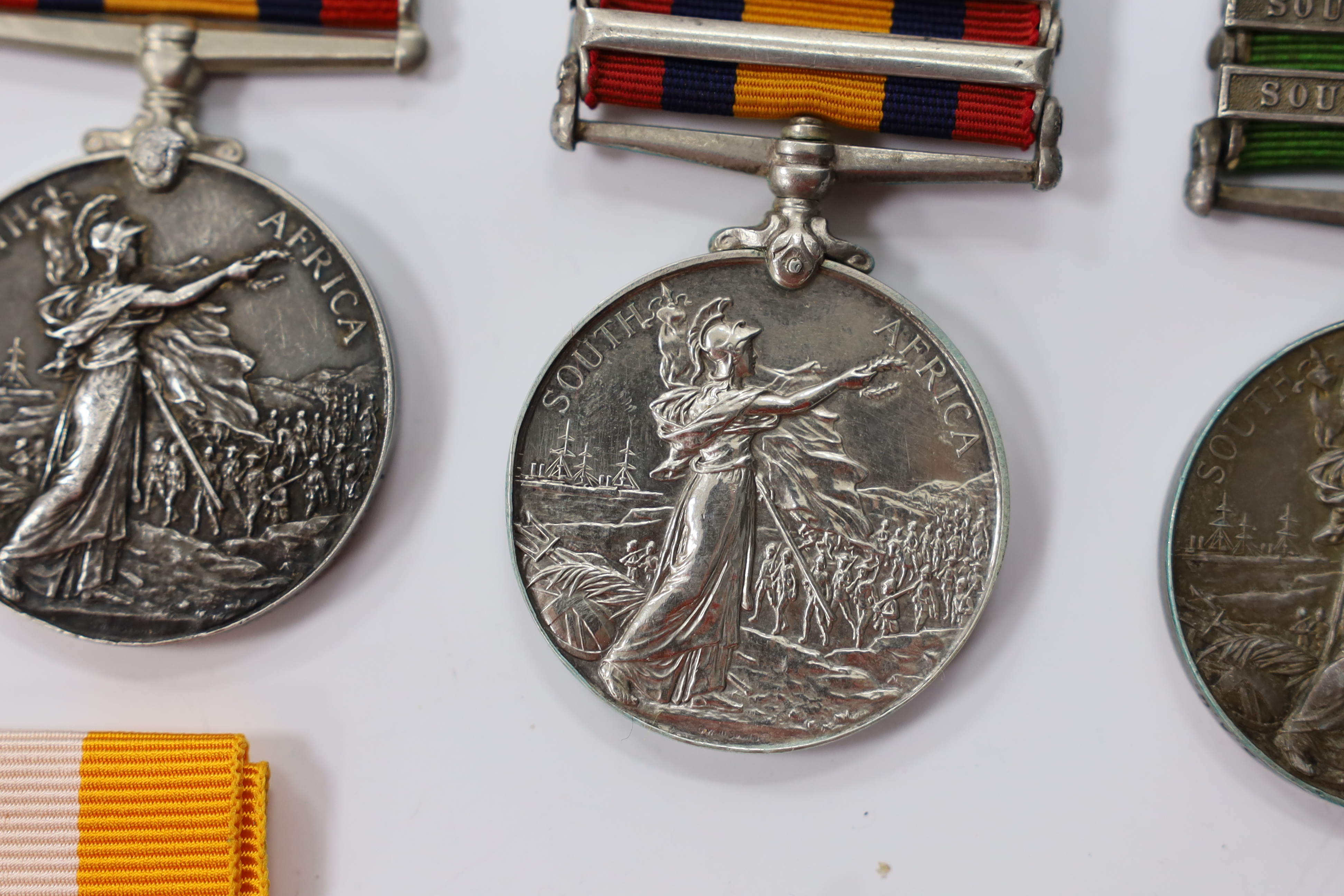 Assorted medals; two replica British North Borneo medals; Balaklava medallion; bronze GV medal; German China Campaign medal; bronze NRA medallion, unnamed